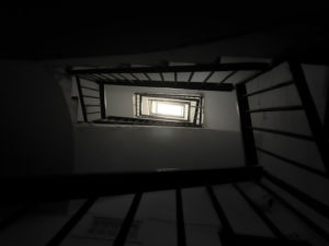 gloomy staircase in a semi-abandoned building gloomy staircase in a semi-abandoned building